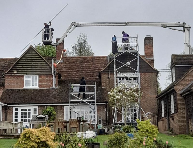 The Roof Moss Cleaners using cherry picker and scaffolding to clean roof safely and professionally in Sawbridgeworth, Hertfordshire