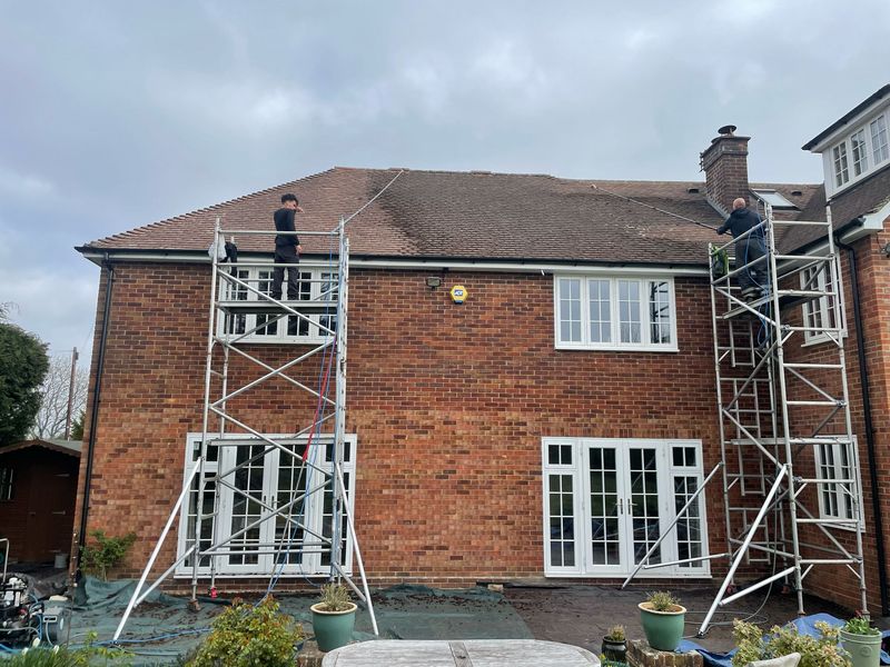 Roof cleaning carried out safely from scaffold towers by The Roof Moss Cleaners in Sawbridgeworth